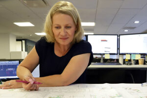 A Woman Working on a Sheet of Paper